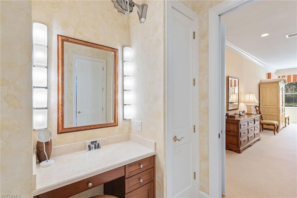 8063 Vizcaya Way Naples, FL 34108 - Photo 21 of 28 a bathroom with a sink and a mirror