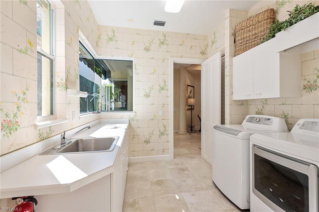 8063 Vizcaya Way Naples, FL 34108 - Photo 22 of 28 a bathroom with a sink a toilet and shower