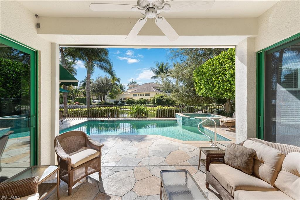 8063 Vizcaya Way Naples, FL 34108 - Photo 23 of 28 a balcony with furniture and garden view