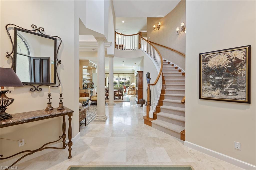 8063 Vizcaya Way Naples, FL 34108 - Photo 3 of 28 a view of entryway and hall with wooden floor
