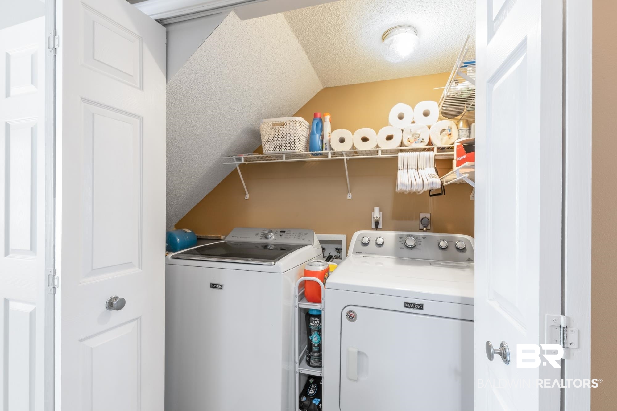 328 Windmill Ridge Road Gulf Shores, AL 36542 - Photo 28 of 47 Laundry area featuring a textured ceiling and washer and dryer