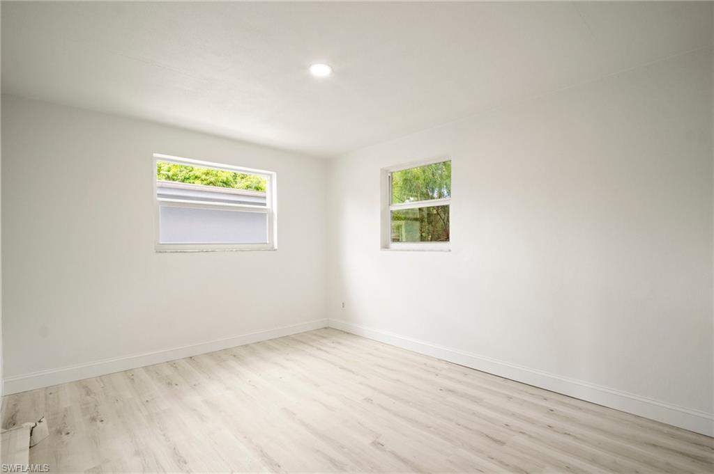 2316 Bayside Street Naples, FL 34112 - Photo 10 of 24 an empty room with a window