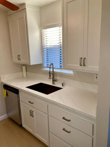 a kitchen with a stove and a microwave