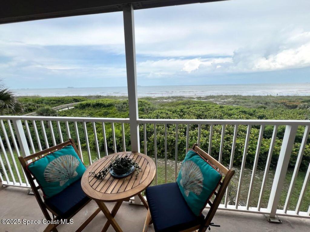 3150 North Atlantic Avenue, Unit 11550 Cocoa Beach, FL 32931 - Photo 19 of 30 a view of a chair and table in the balcony