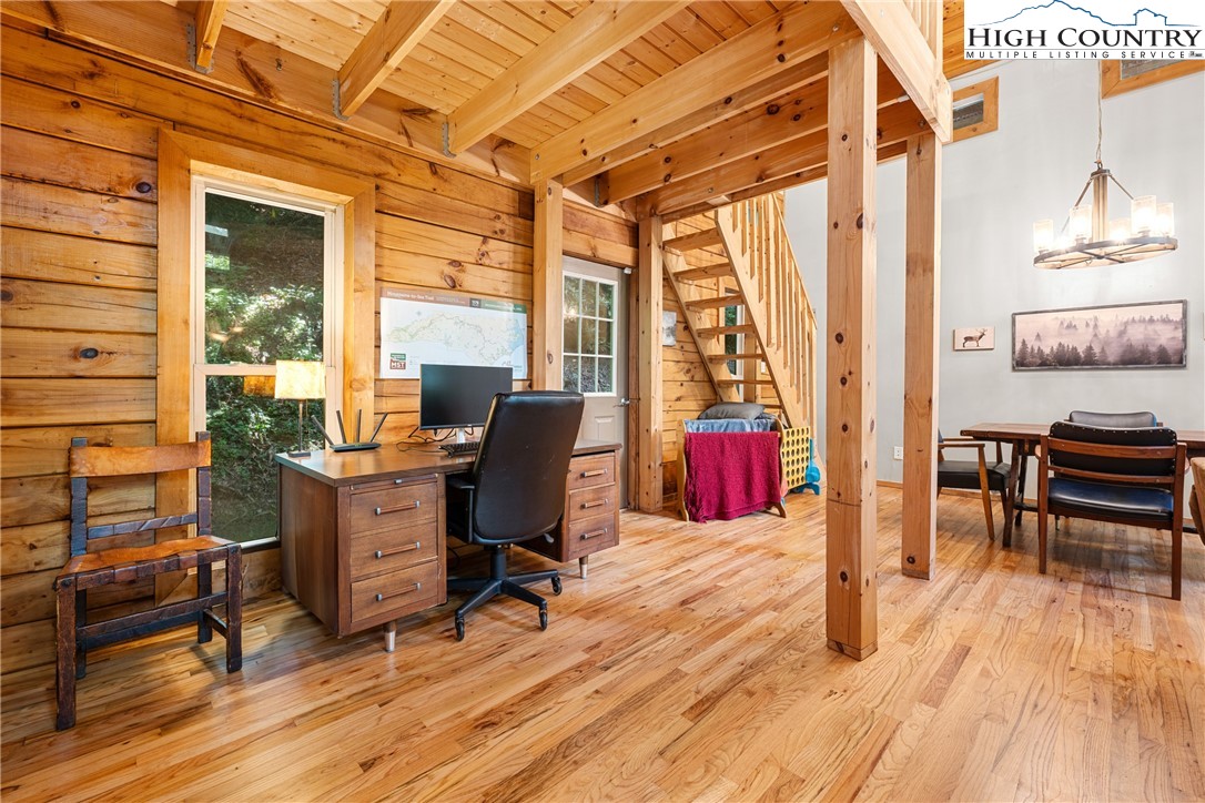 375 Winterberry Trail Boone, NC 28607 - Photo 17 of 36 a view of a workspace with furniture and a window