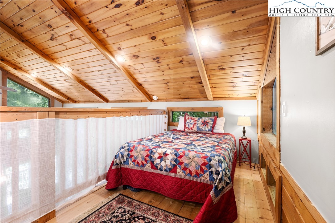 375 Winterberry Trail Boone, NC 28607 - Photo 18 of 36 a bedroom with a bed and a window