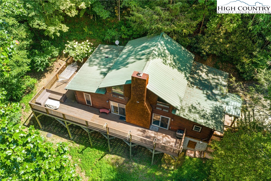 375 Winterberry Trail Boone, NC 28607 - Photo 2 of 36 an aerial view of a house with a yard and large trees