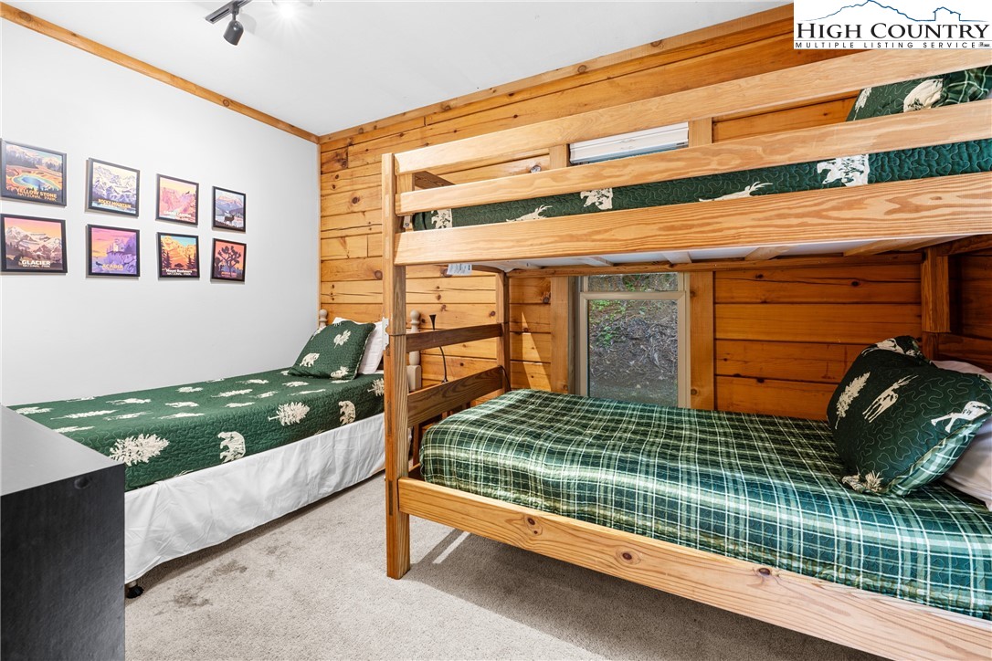 375 Winterberry Trail Boone, NC 28607 - Photo 23 of 36 a bedroom with a bed and a window