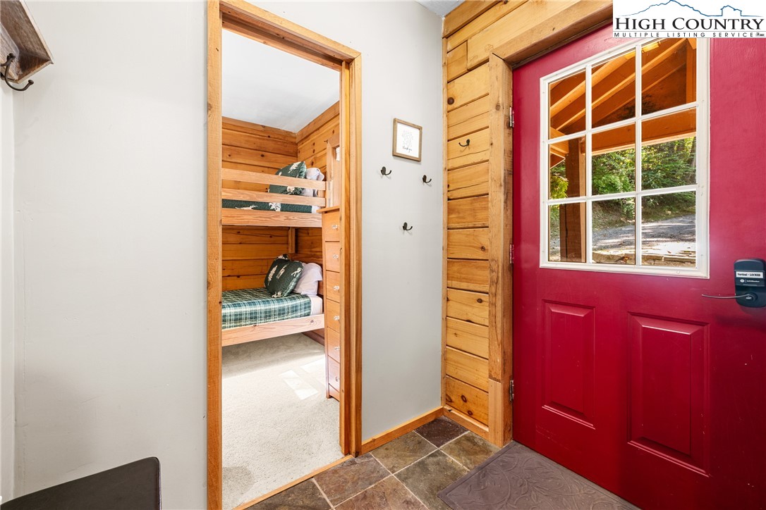 375 Winterberry Trail Boone, NC 28607 - Photo 24 of 36 a view of a hallway with wooden floor and windows