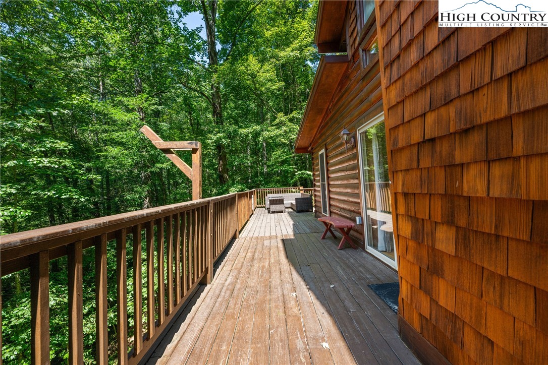 375 Winterberry Trail Boone, NC 28607 - Photo 27 of 36 a view of balcony with wooden floor and fence