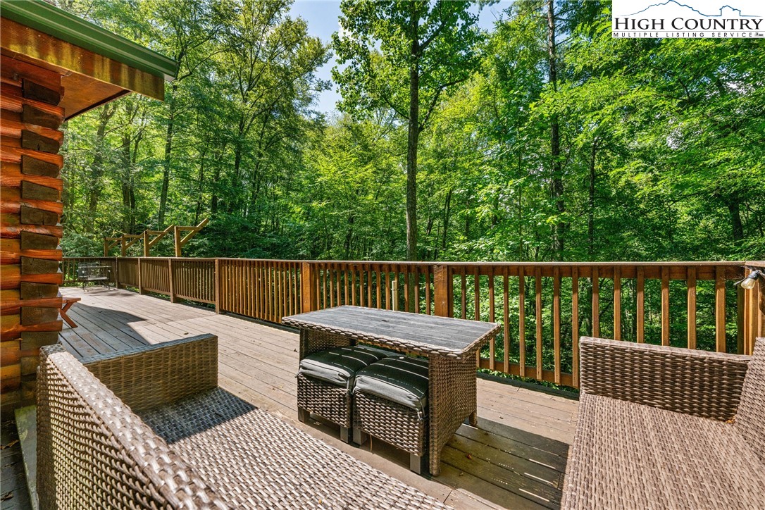 375 Winterberry Trail Boone, NC 28607 - Photo 28 of 36 a view of balcony with wooden floor and outdoor seating