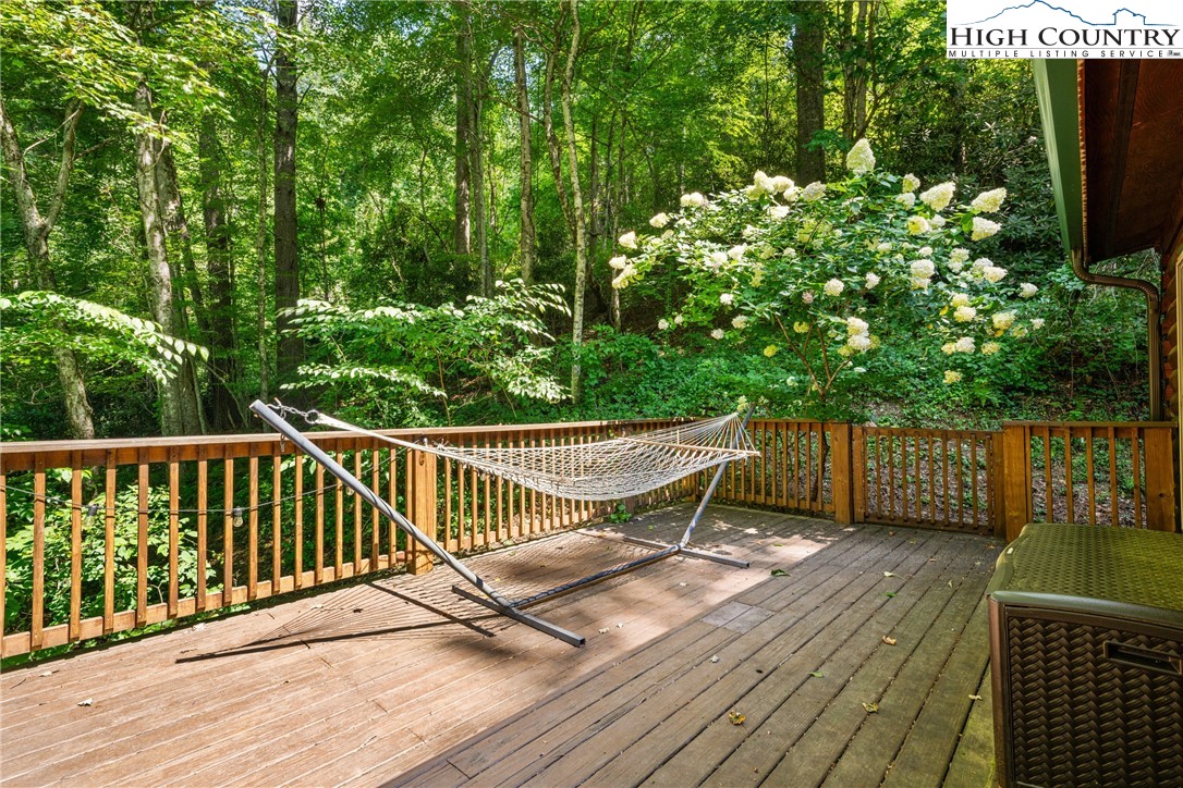 375 Winterberry Trail Boone, NC 28607 - Photo 30 of 36 a view of balcony with wooden floor and outdoor seating
