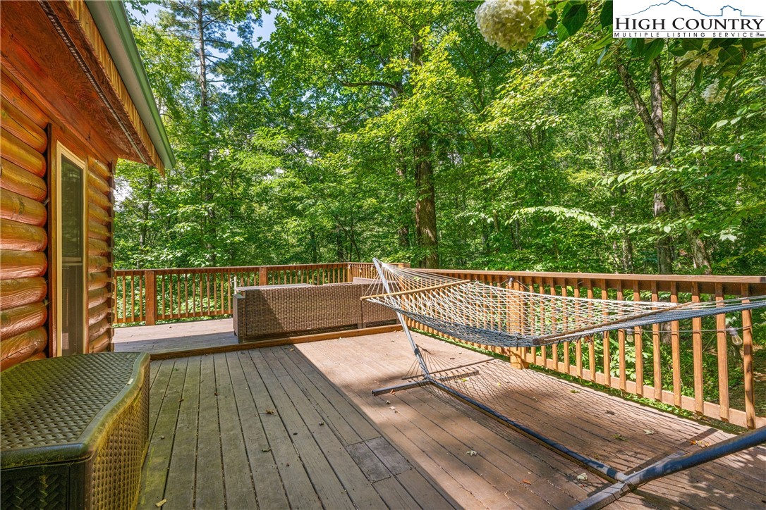 375 Winterberry Trail Boone, NC 28607 - Photo 31 of 36 a view of a balcony with wooden floor and fence