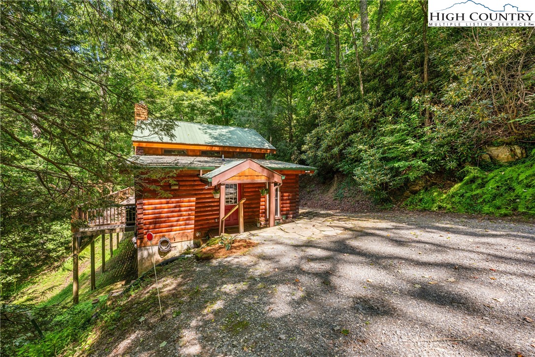 375 Winterberry Trail Boone, NC 28607 - Photo 32 of 36 a view of a house with a tree and a yard