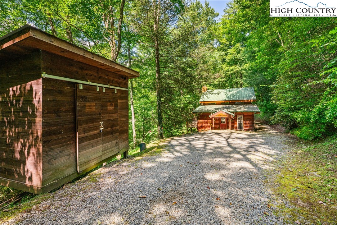 375 Winterberry Trail Boone, NC 28607 - Photo 34 of 36 a backyard of a house with lots of green space