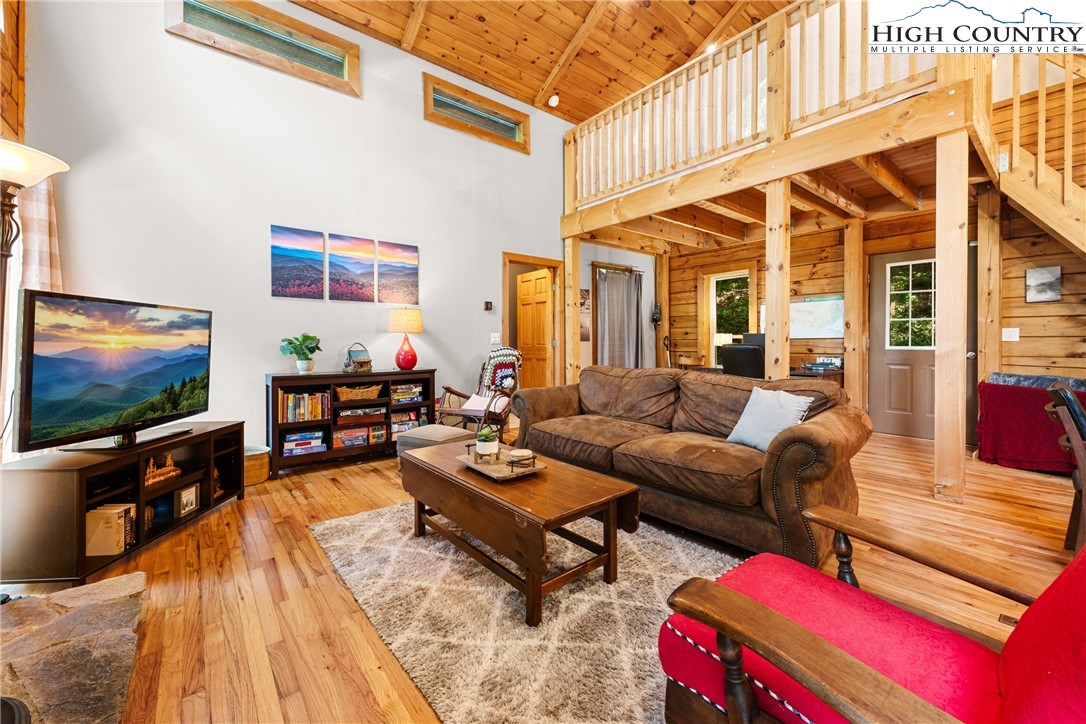 375 Winterberry Trail Boone, NC 28607 - Photo 4 of 36 a living room with furniture and a flat screen tv