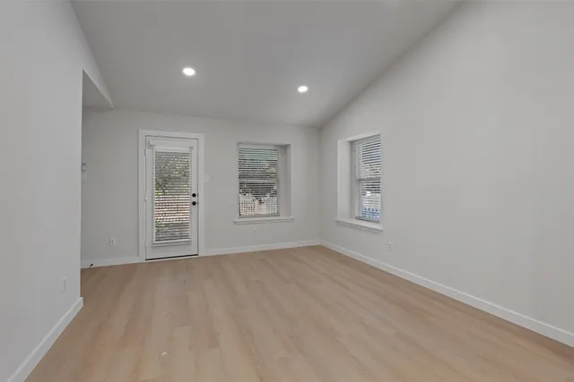 a view of an empty room with a window