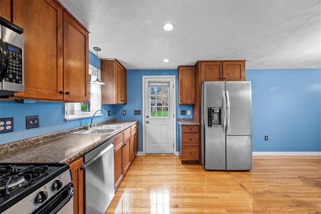 200 Hartle Road Glenshaw, PA 15116 - Photo 11 of 24 a kitchen with stainless steel appliances granite countertop a refrigerator and a stove