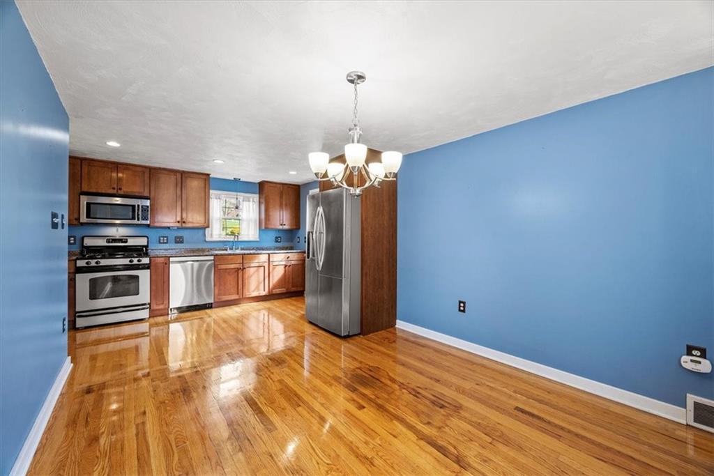 200 Hartle Road Glenshaw, PA 15116 - Photo 12 of 24 a kitchen with stainless steel appliances granite countertop a refrigerator a oven a sink and a wooden floors