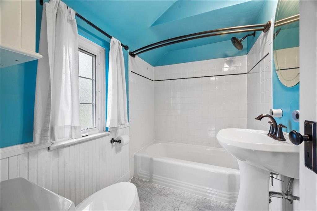 200 Hartle Road Glenshaw, PA 15116 - Photo 14 of 24 a bathroom with a sink and a bathtub