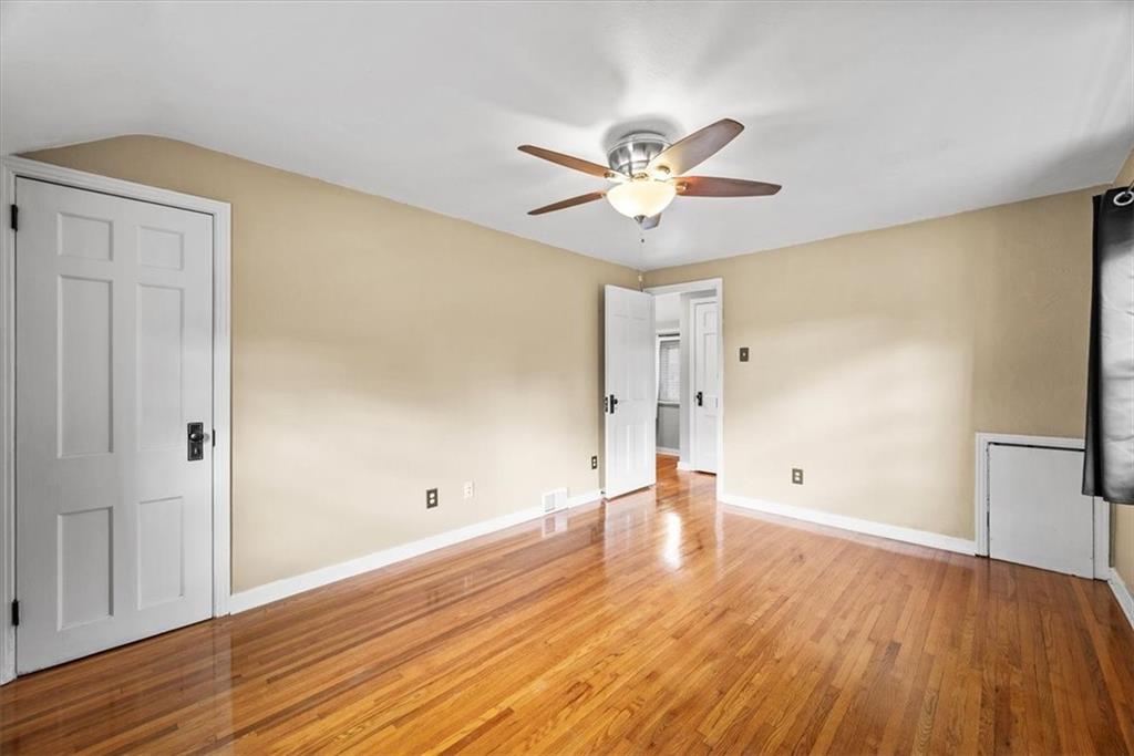 200 Hartle Road Glenshaw, PA 15116 - Photo 16 of 24 a view of an empty room with wooden floor