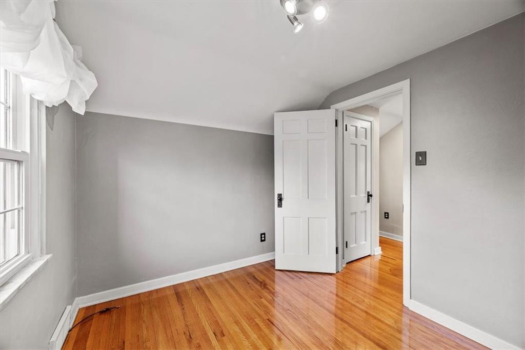 200 Hartle Road Glenshaw, PA 15116 - Photo 18 of 24 a view of empty room with wooden floor and fan