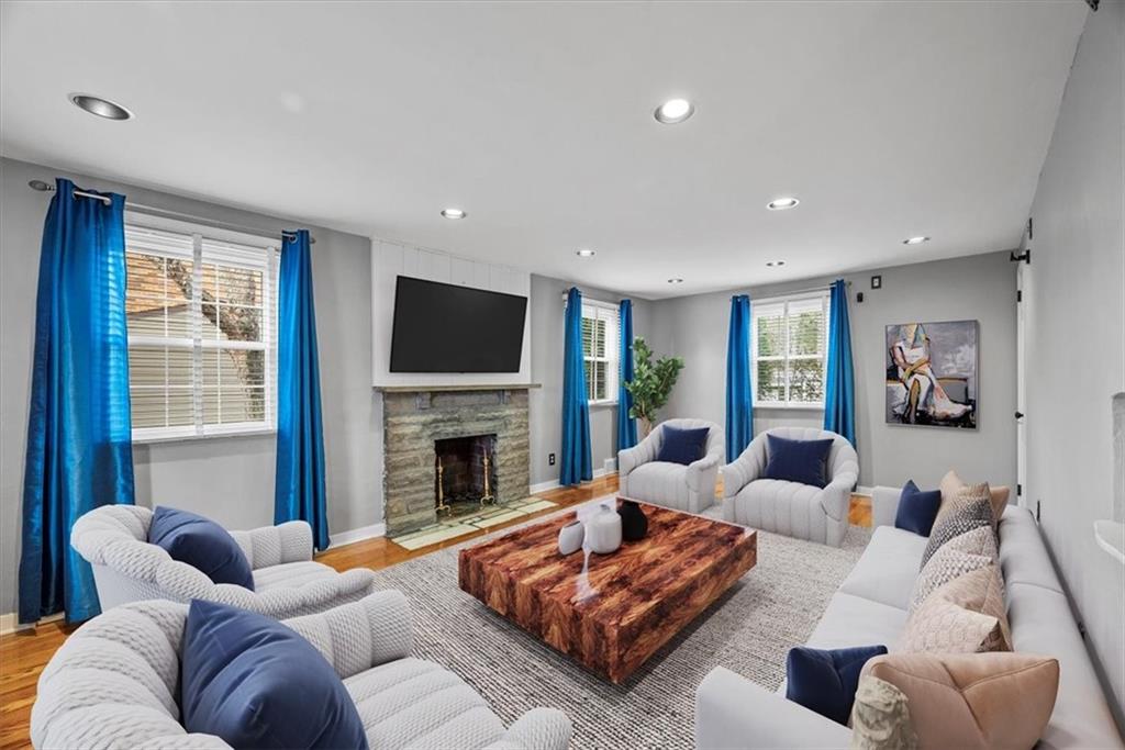 200 Hartle Road Glenshaw, PA 15116 - Photo 3 of 24 a living room with furniture fireplace and a flat screen tv