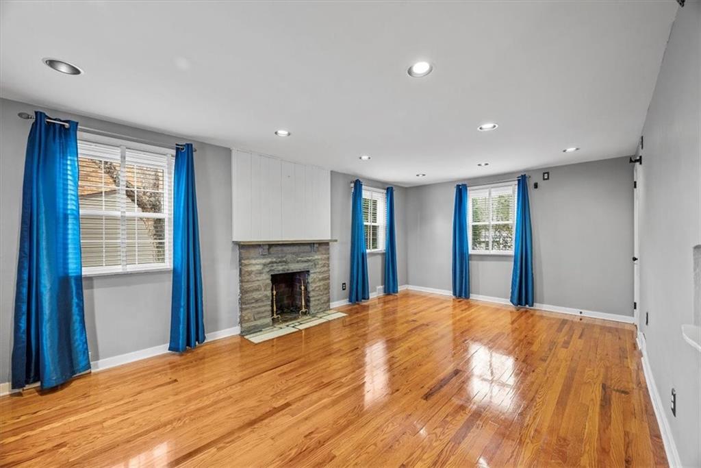 200 Hartle Road Glenshaw, PA 15116 - Photo 4 of 24 a large bedroom with a bed and a fireplace