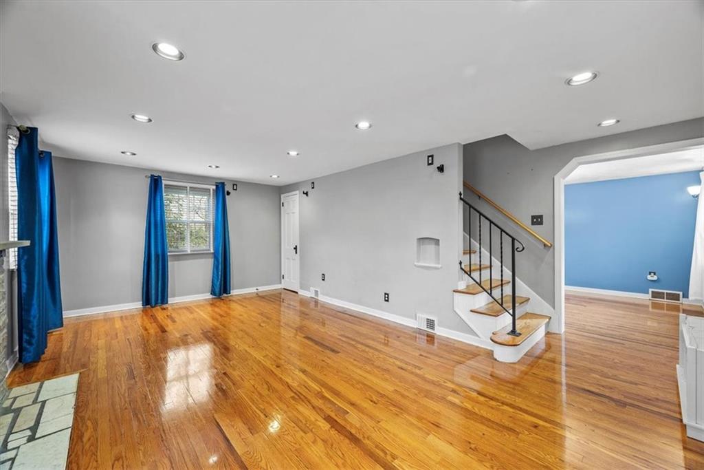 200 Hartle Road Glenshaw, PA 15116 - Photo 5 of 24 a big room with wooden floor and windows