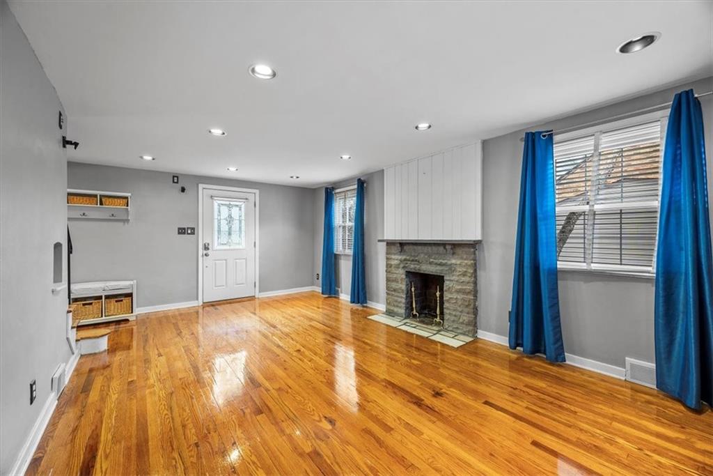 200 Hartle Road Glenshaw, PA 15116 - Photo 6 of 24 a view of an empty room with window and fire place