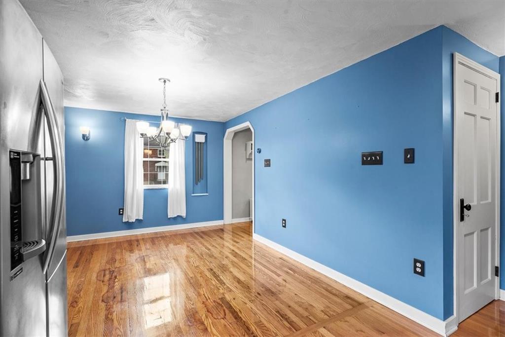 200 Hartle Road Glenshaw, PA 15116 - Photo 8 of 24 a view of empty room with wooden floor