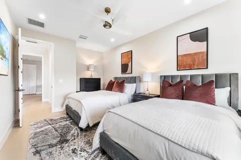 an aerial view of residential houses with outdoor space and street view