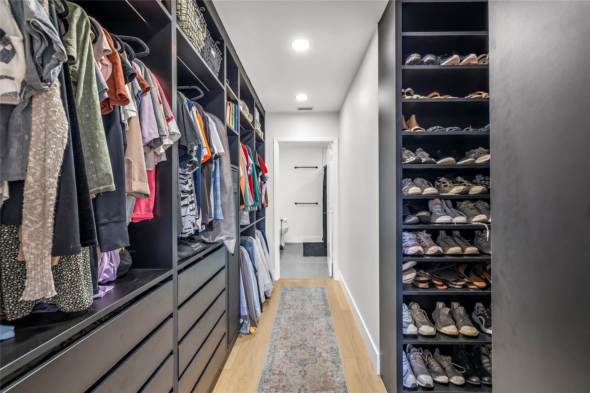 8610 Kimble Way Boca Raton, FL 33433 - Photo 11 of 26 a view of walk in closet with clothes and shoes