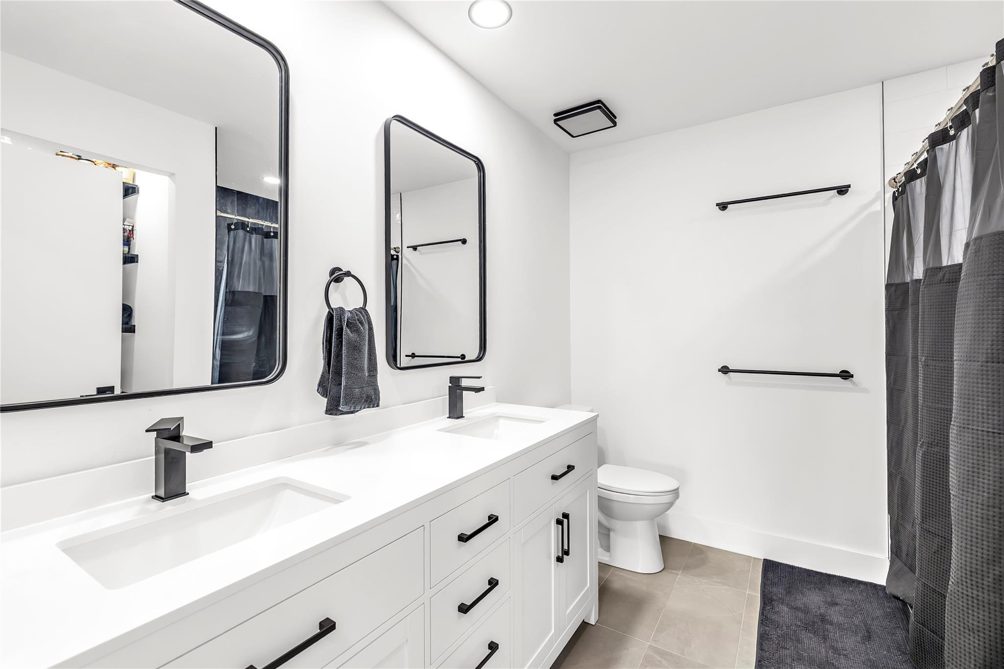 8610 Kimble Way Boca Raton, FL 33433 - Photo 12 of 26 a bathroom with a sink and a mirror