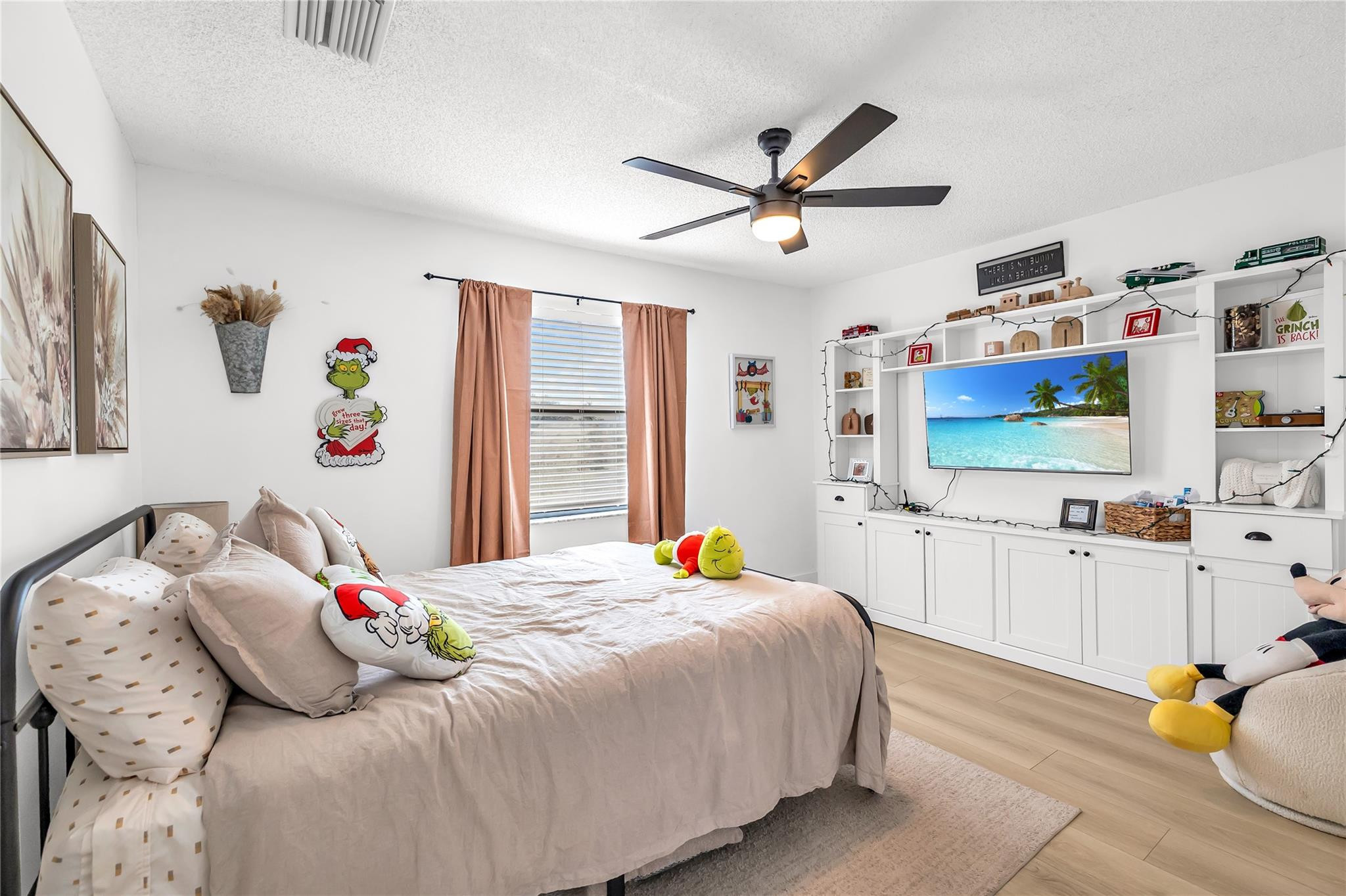 8610 Kimble Way Boca Raton, FL 33433 - Photo 14 of 26 a bedroom with a bed dresser and a flat tv screen