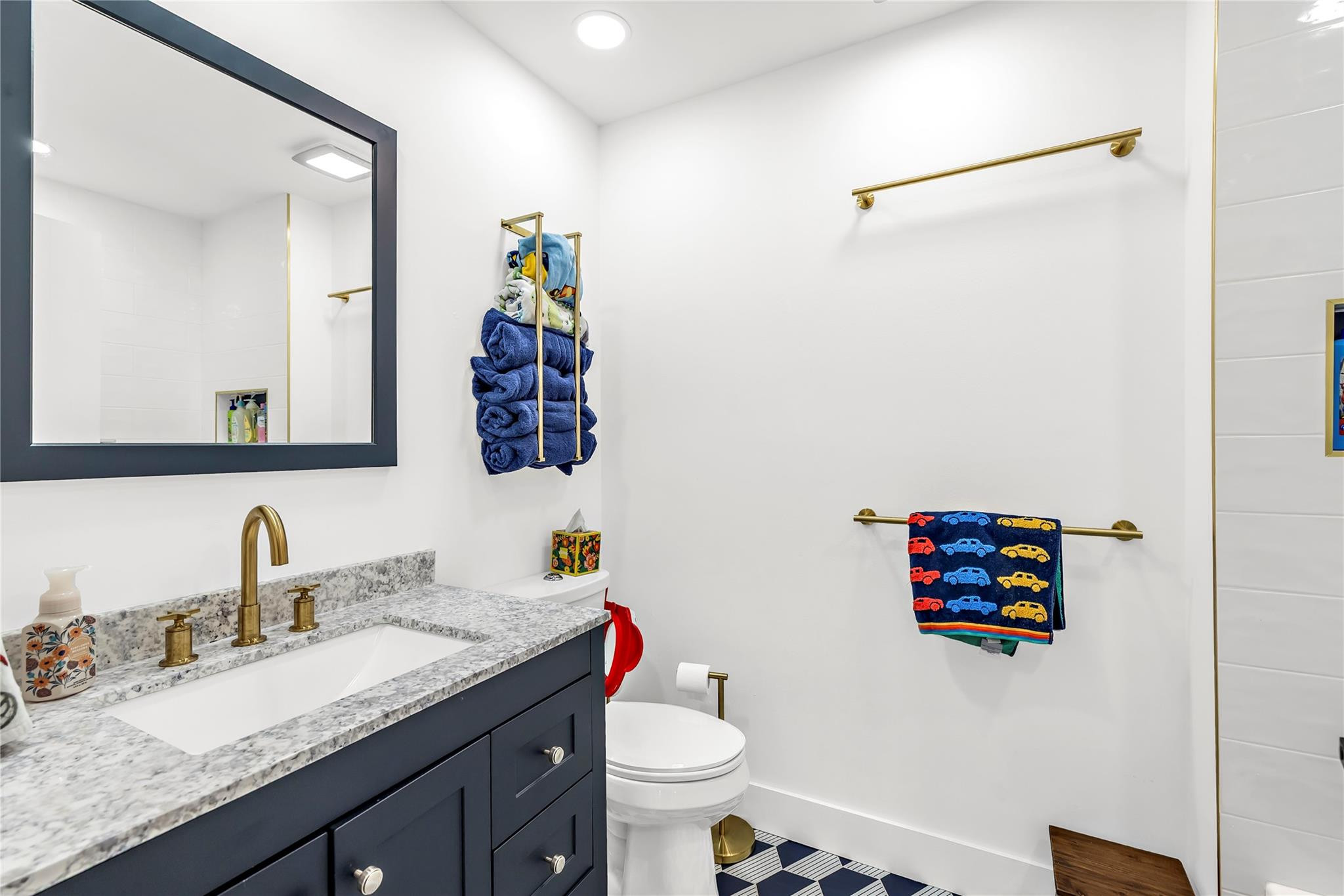 8610 Kimble Way Boca Raton, FL 33433 - Photo 15 of 26 a bathroom with a granite countertop sink a toilet and a mirror