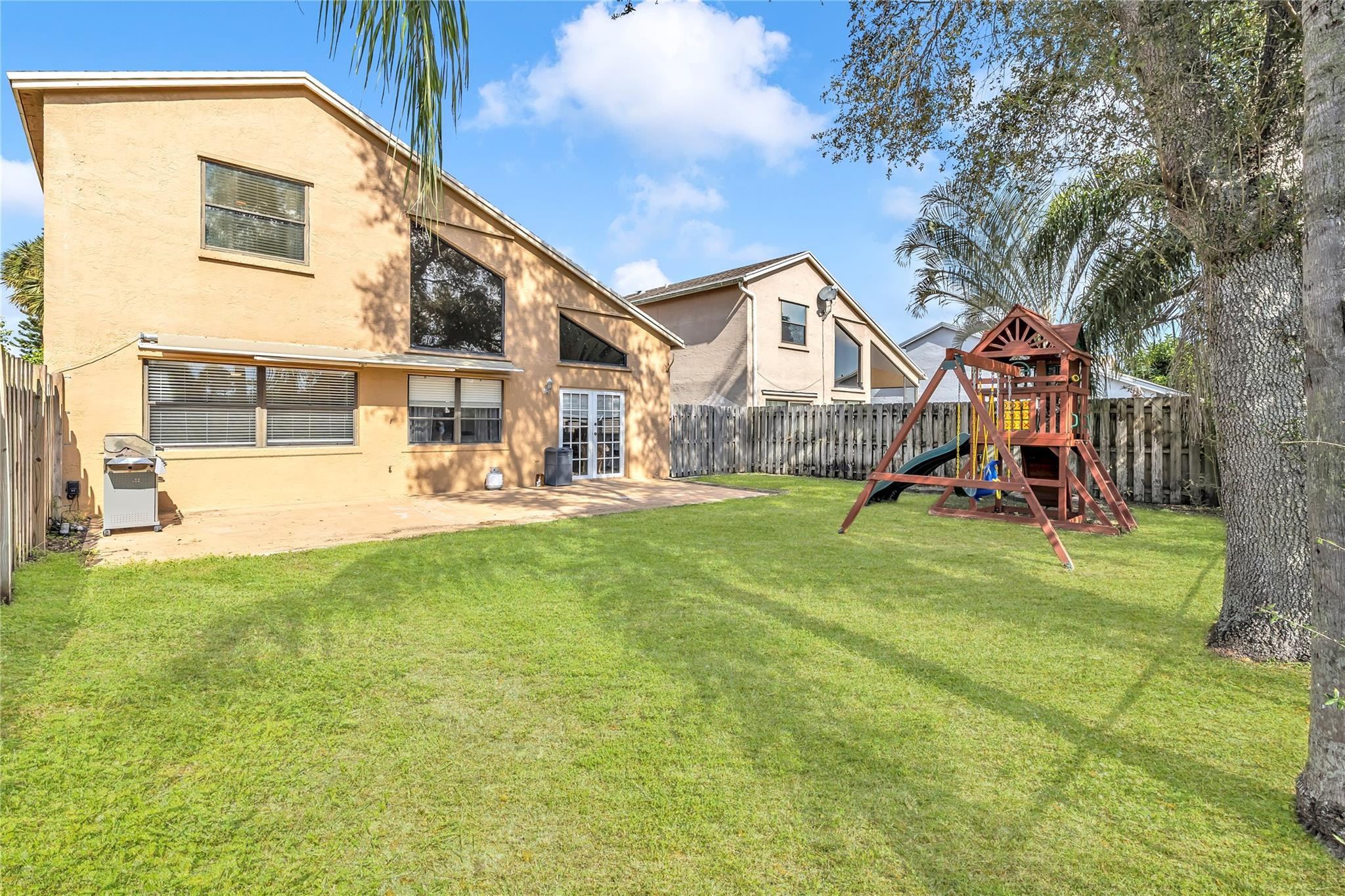 8610 Kimble Way Boca Raton, FL 33433 - Photo 18 of 26 a view of an house with backyard and a tree