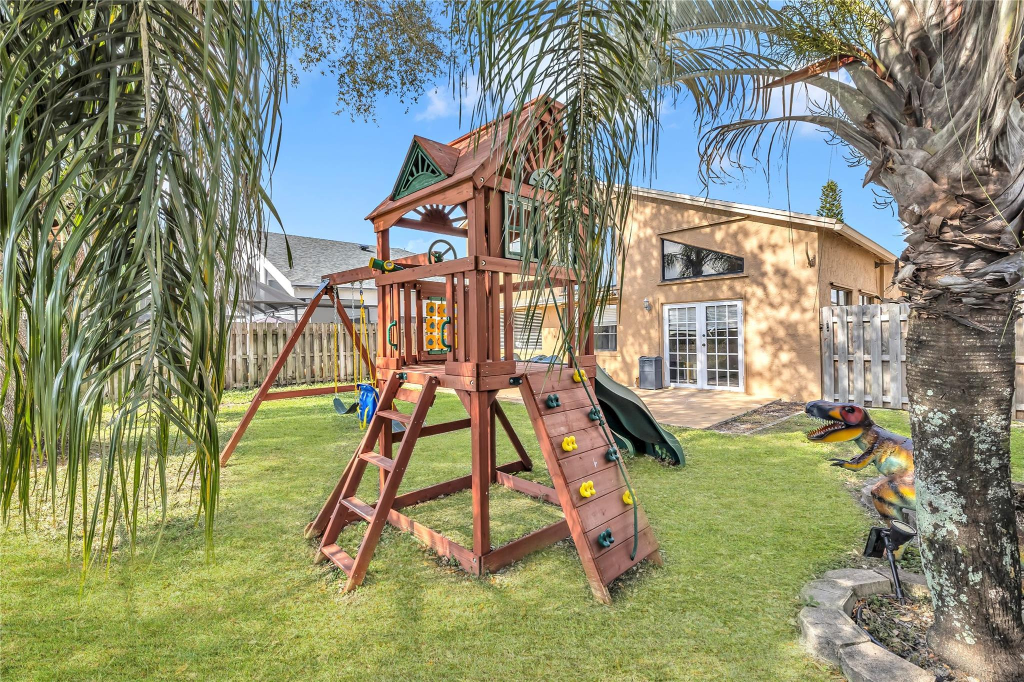 8610 Kimble Way Boca Raton, FL 33433 - Photo 19 of 26 a backyard of a house with table and chairs