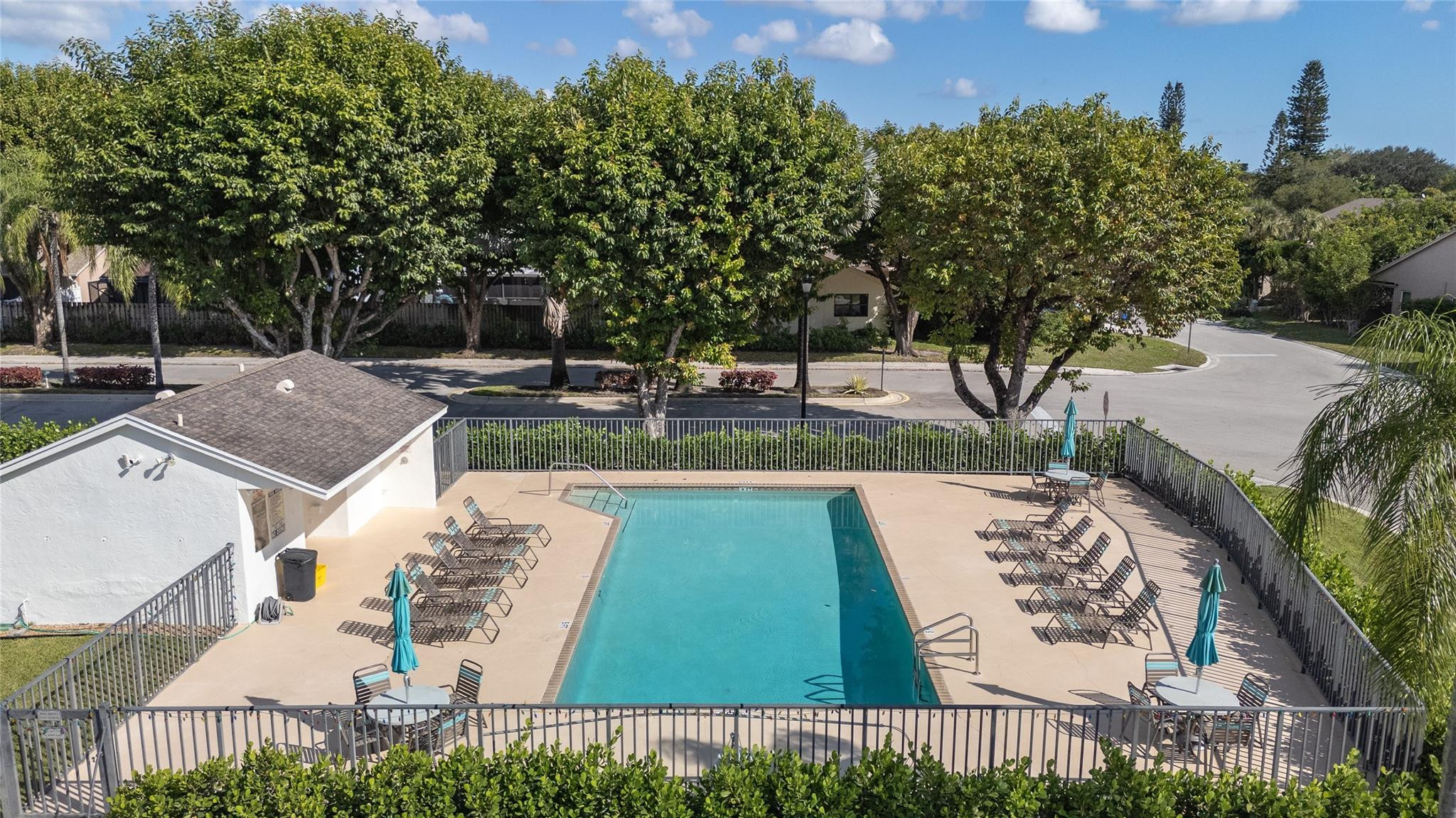 8610 Kimble Way Boca Raton, FL 33433 - Photo 23 of 26 a view of a patio with table and chairs and potted plants