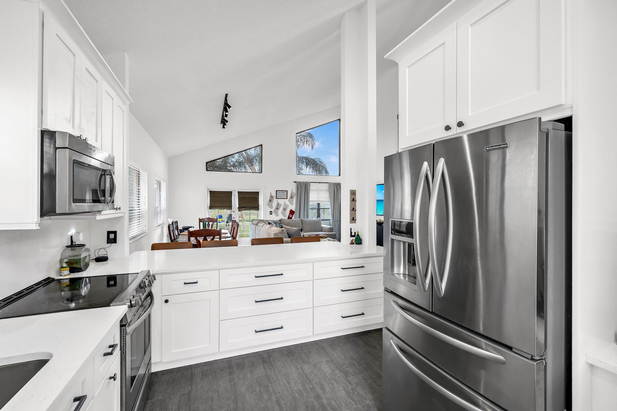 8610 Kimble Way Boca Raton, FL 33433 - Photo 6 of 26 a kitchen with stainless steel appliances a refrigerator stove and sink