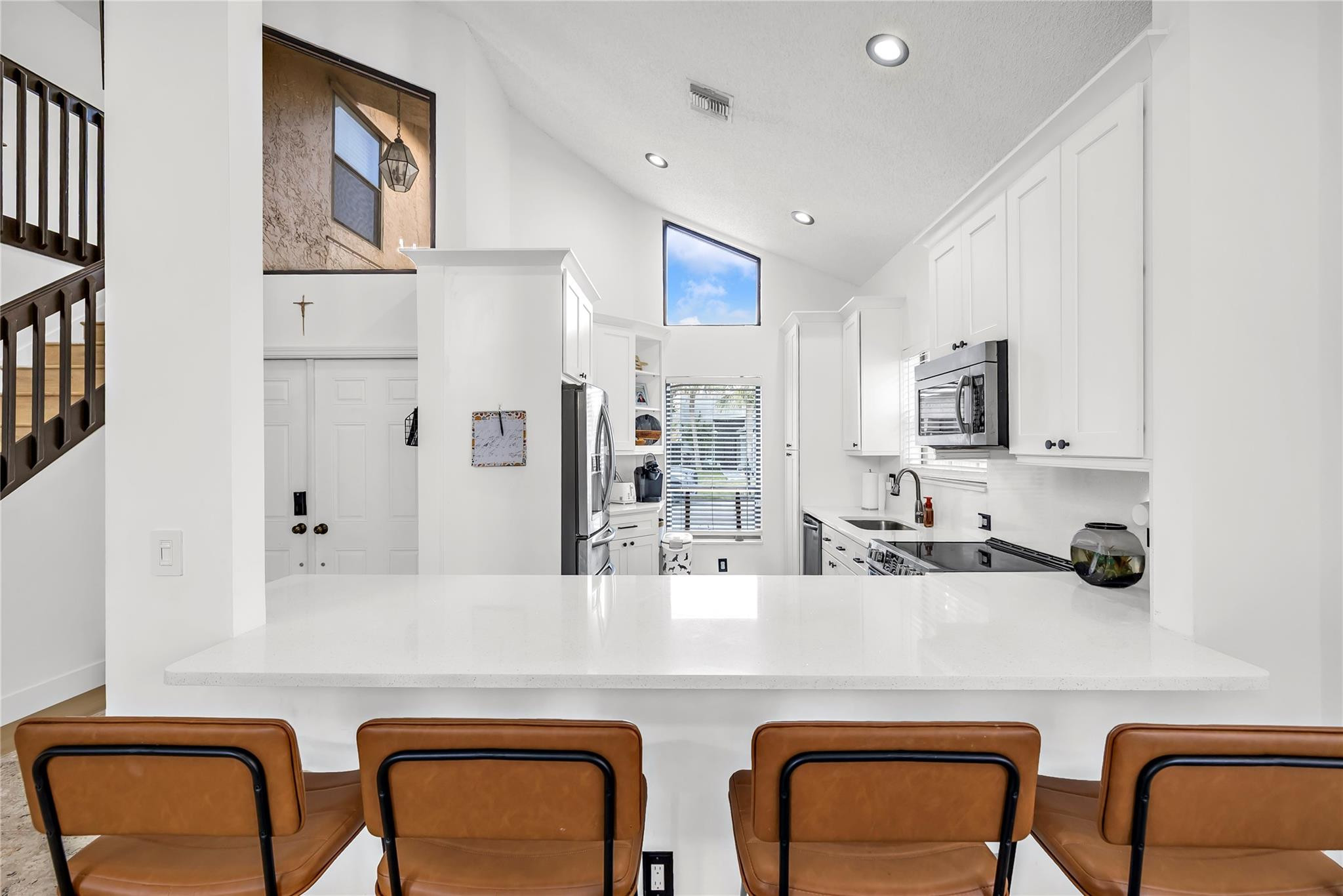 8610 Kimble Way Boca Raton, FL 33433 - Photo 7 of 26 a kitchen with cabinets and chairs