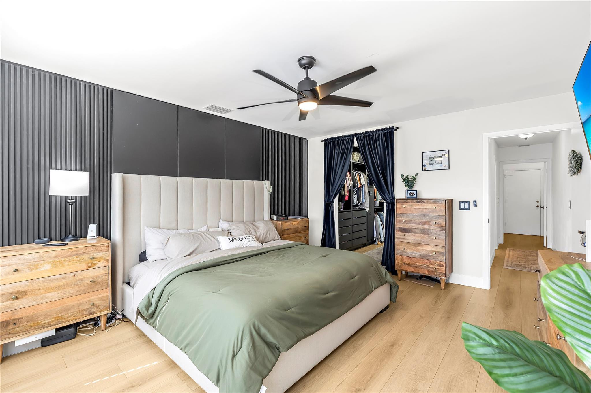 8610 Kimble Way Boca Raton, FL 33433 - Photo 10 of 26 a bedroom with a bed and a walk in closet