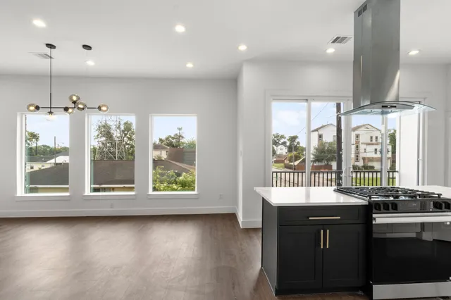 a bathroom with a large window and sink
