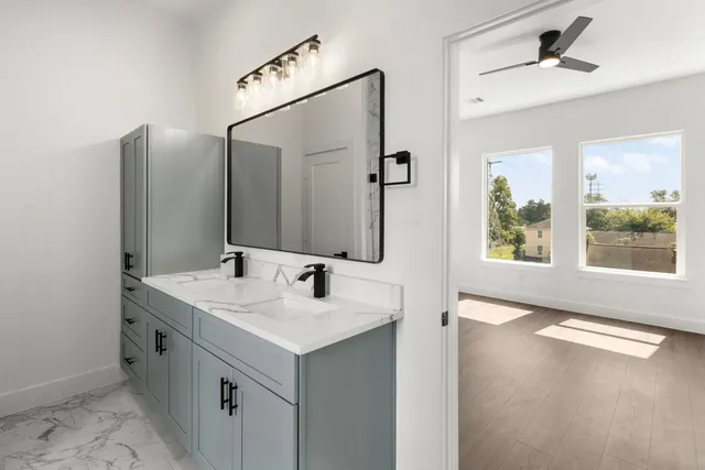 a bathroom with a sink and a mirror