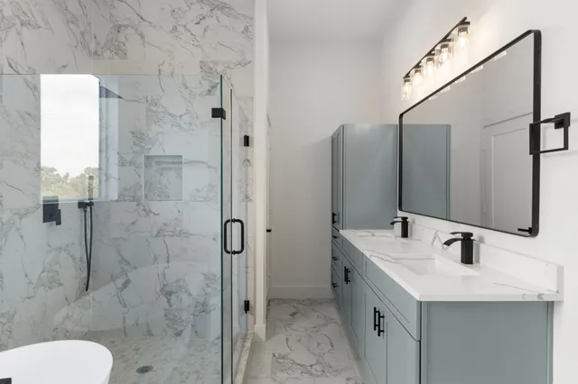 a bathroom with a sink toilet and shower