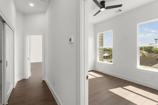 a view of hallway with windows