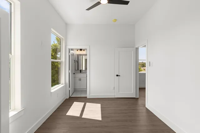 a view of an entryway with wooden floor and windows
