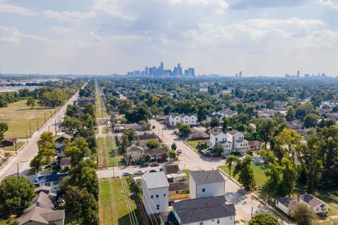 an aerial view of a city with lots of residential buildings