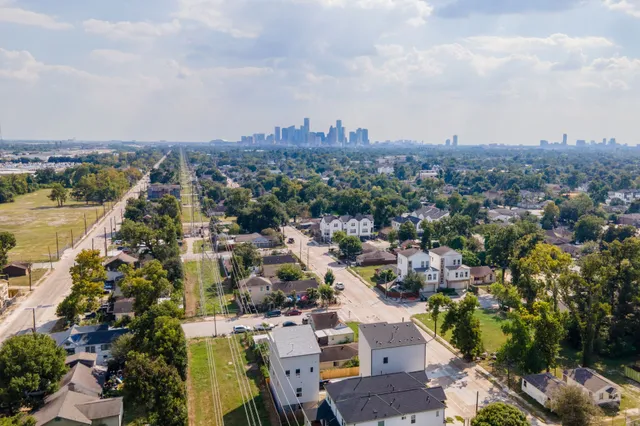 an aerial view of a city with lots of residential buildings