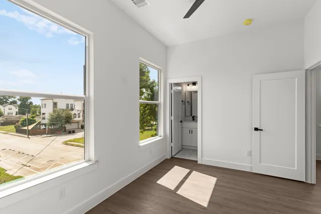 a view of an empty room and glass door